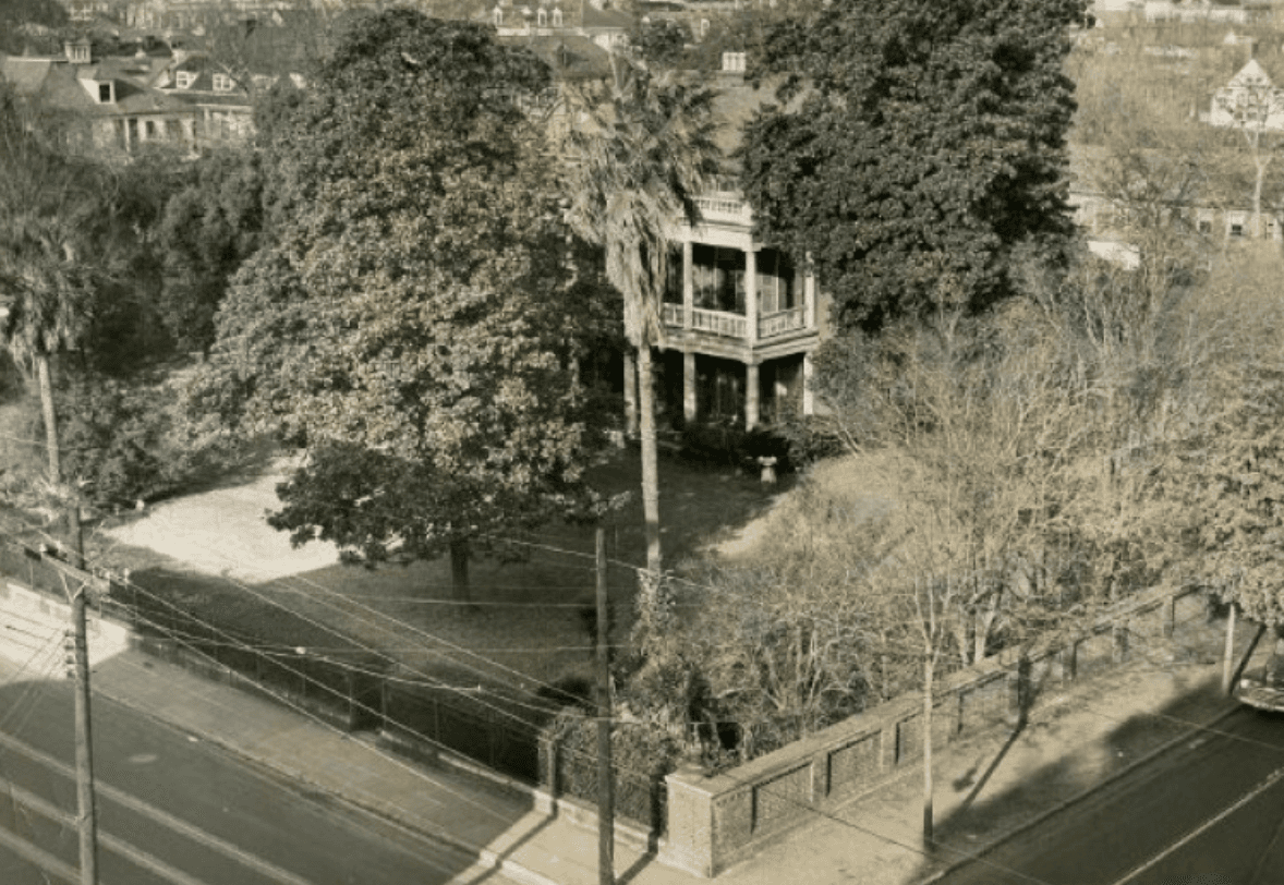 Mid-20th-century photograph of the Memminger House at 150 Wentworth Street, with the brick wall along Smith Street visible in the foreground