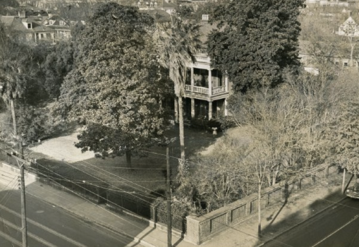 Mid-20th-century photograph of the Memminger House at 150 Wentworth Street, with the brick wall along Smith Street visible in the foreground