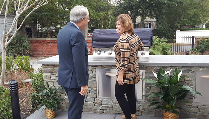 Vicki shows Mayor Tecklenberg the new outdoor kitchen donated by the USCG Chief Petty Officer's Association of the Low Country